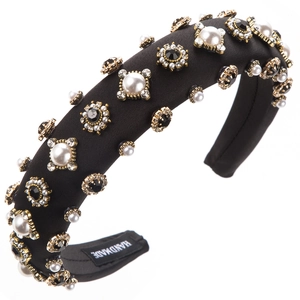 Detail of handmade padded black headband with pearls and sparkling rhinestones