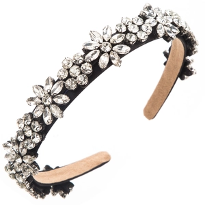 Detail shot of a floral crystal headband with sparkling rhinestones on black fabric