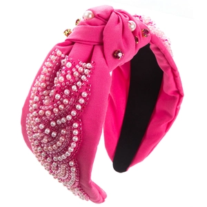 Detailed view of handmade rose red knotted headband with pearls and red rhinestones
