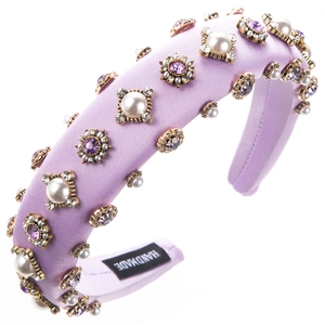 Baroque purple padded headband with faux pearls and rhinestones on white background