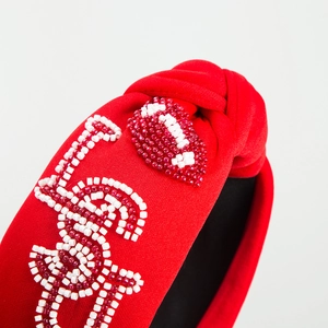 Fashion red fabric headband with handmade beaded lip pattern and letter S detail