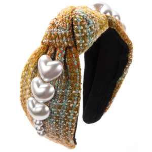 Detail of multi-color tweed headband featuring a top knot and heart pearl accents