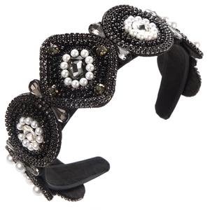 Detailed close-up of baroque style headband with hand-sewn pearls and rhinestones