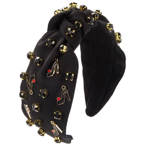 Close-up of black knotted headband with crystal clusters and enamel high heel charms