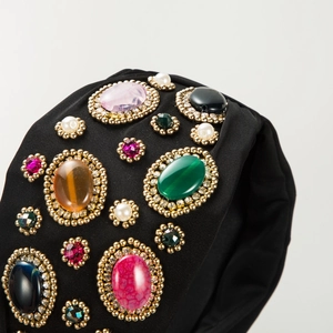 Bohemian style wide fabric headband featuring colorful gemstones and pearls detail