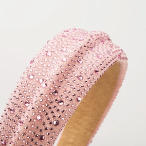 Elegant vintage pink rhinestone padded headband with sparkling crystal beads and knot detail