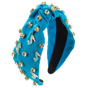Close-up of blue knotted headband with crystal rhinestones and high heel charms