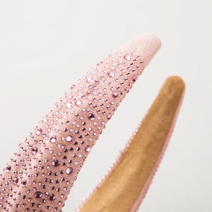 Pink rhinestone padded headband with sparkling crystals and non-slip lining for women