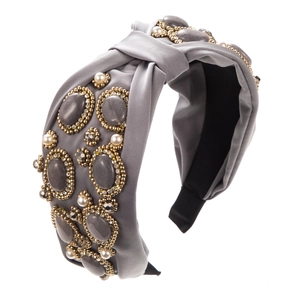 Detail of gray fabric headband with hand-sewn geometric stones and pearl embroidery