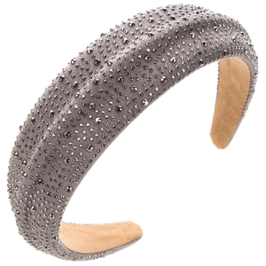 Detail of wide padded headband featuring sparkling dark grey rhinestones on grey velvet fabric