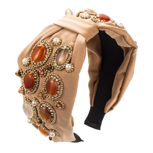 Detail of bohemian headband with colorful gemstones, pearls and khaki satin fabric
