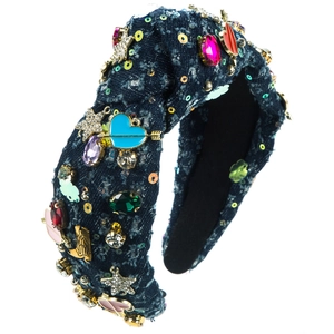 Detailed side view of denim headband with colorful rhinestones and gold alloy charms