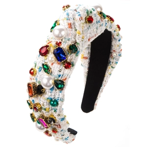 Detail of luxury white tweed headband featuring colorful rhinestones and faux pearls