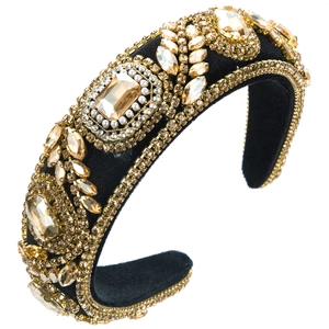 Close-up detail of luxury velvet padded headband with gold crystals and pearls
