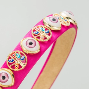 Magenta satin headband featuring golden tree of life and devil eye charms for women