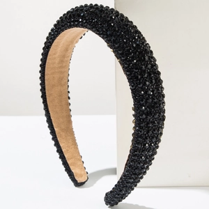 Baroque padded headband with black crystal beads and beige suede lining displayed on white stand