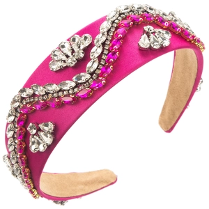 Detail of rose pink satin baroque headband with sparkling crystals and beige suede lining
