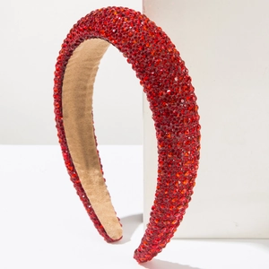 Detail of red rhinestone sponge headband featuring a soft non-slip velvet inner lining