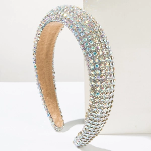 Detailed macro view of wide padded headband with shimmering AB rhinestones and velvet lining