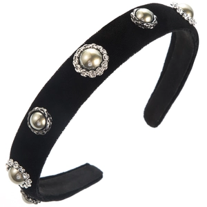 Detail of black velvet headband with elegant gray pearls and silver metal settings