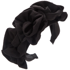 Detailed close-up of large handmade black fabric roses on a textured fabric headband