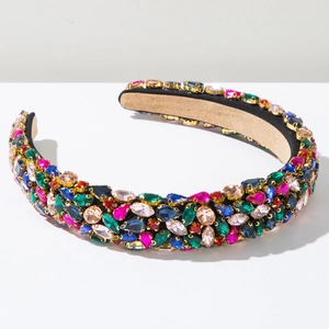 Detailed macro view of heavy crystal embroidery on luxury baroque padded headband