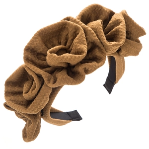 Brown fabric headband with three large layered rose flowers on a white background