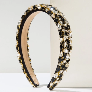 Close-up of black and white rhinestones on a thick baroque velvet padded headband