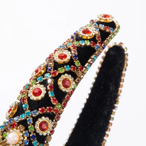 Velvet headband featuring ornate gold mesh, vibrant colorful rhinestones and pearls