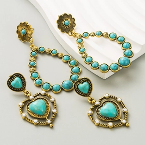 Bohemian drop earrings with turquoise stones and vintage gold finish in heart shape