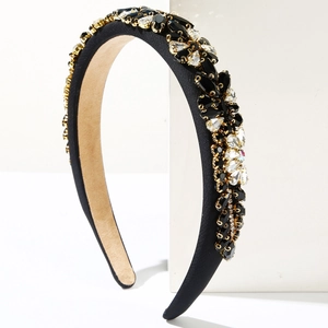 Baroque fashion headband with sparkling crystals on black satin and golden metal settings