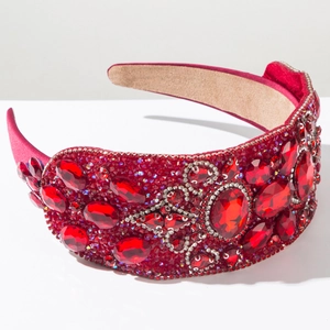 Detail of red rhinestone headband featuring thick wide brim and multi-cut gemstone patterns