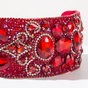 Macro shot of luxury red baroque headband with dense rhinestones and crystals