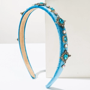 Baroque blue velvet headband with sparkling blue rhinestones and gold-tone metal base