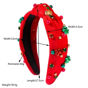 Cerchietto natalizio a nodo con perline rosse e verdi e fiocchi festivi decorati