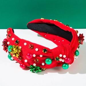 Detailansicht des roten Weihnachts-Haarreifens mit Perlen, Strass und Schleifen-Deko