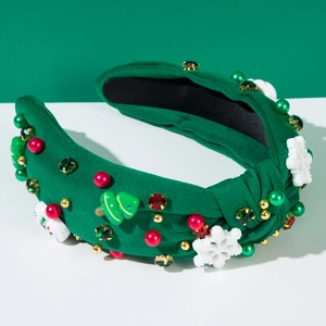 Détail du serre-tête de Noël vert en tricot avec bonhomme de neige et strass brillants