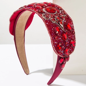 Detailed macro view of deep red luxury baroque headband with crystals and gems
