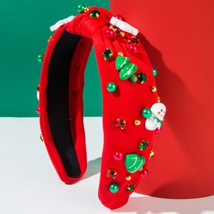 Serre-tête de Noël avec décorations en résine et strass colorés sur une base en tissu rouge