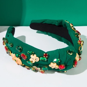 Detail of Christmas knot headband with gingerbread man charms and colorful rhinestones