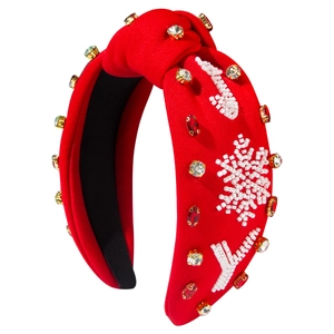 Red knotted Christmas headband with snowflakes, beads and JOY lettering decorations