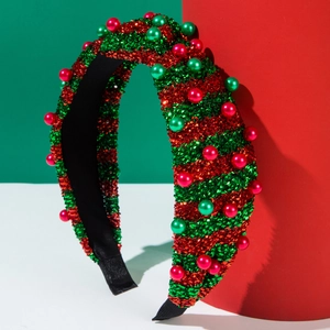 Dettaglio cerchietto glitter rosso e verde con perle per feste natalizie