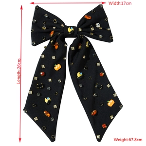 Barrette nœud d'Halloween noire avec strass colorés et breloques citrouille lune