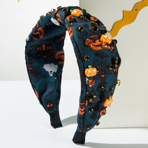 Halloween knot headband featuring festive pumpkin prints and sparkly rhinestone accents