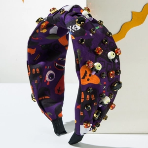 Halloween knot headband featuring purple satin print with rhinestones and eyeball motifs