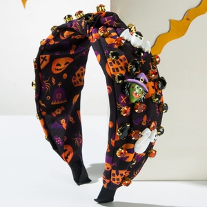 Detail of Halloween headband with pumpkin patterns, 3D ghost charms, and sparkling rhinestones