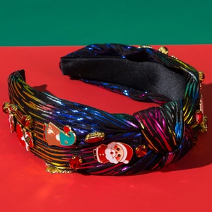 Detail of Christmas headband with colorful stripes, enamel Santa charms and red rhinestones