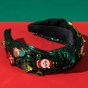 Detailed view of green metallic fabric Christmas headband with festive alloy charms
