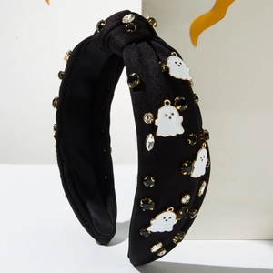 Détail du serre-tête nœud d'Halloween avec breloques fantômes blancs et strass brillants