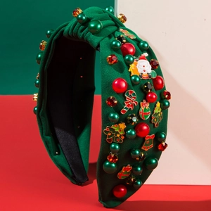 Festive Christmas headband featuring Santa and tree charms with pearls on green fabric